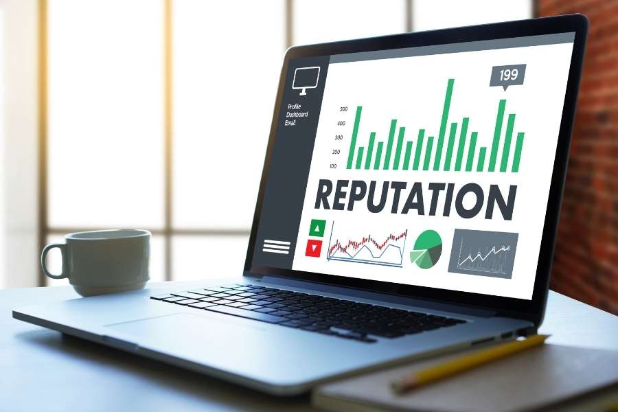 Laptop screen displaying reputation analytics dashboard for brand reputation management tracking